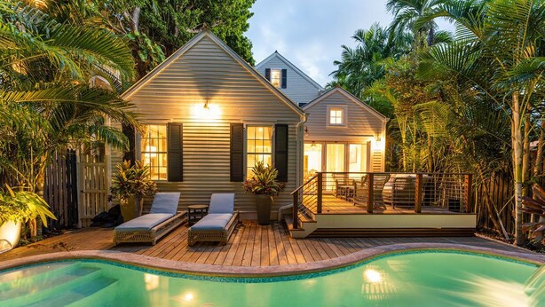 A house with a swimming pool, wooden deck, and lounge chairs. - The Gideon Lowe House - Old Town Key West  (Key West)