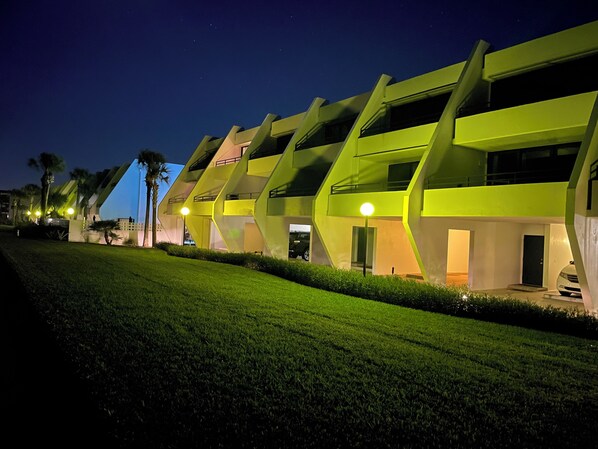 A modern hotel with a unique architectural design featuring multiple levels and balconies. - Flagler Beach, Florida<br>Ocean-View Townhome<br> Aliki Sunrise Surprise! 🚀🌊🏖️☀️ (Flagler Beach)