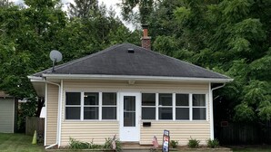 A single-story house with a gabled roof, a chimney, and a satellite dish. - Perfect Location Just 0.5 Miles from Notre Dame’s Campus! (South Bend)