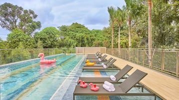 Outdoor pool, open 6:00 AM to 10:00 PM, pool loungers