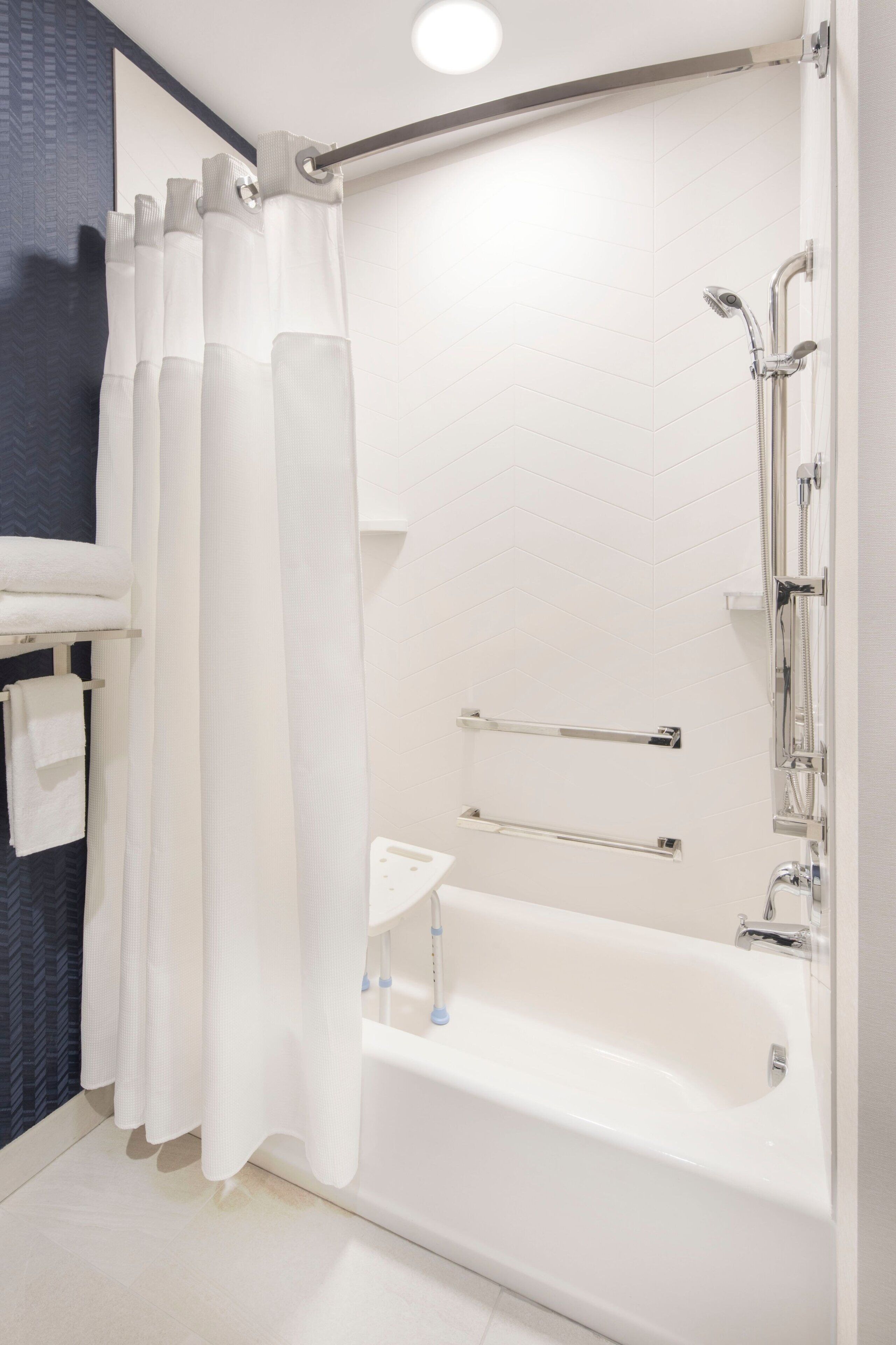 rainfall showerhead, hair dryer, towels, soap