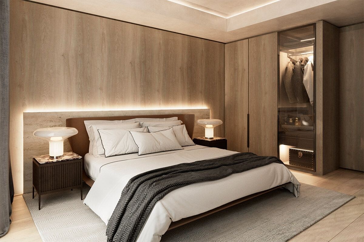 A modern bedroom with a large bed, bedside lamps, a wardrobe, and a mirror.