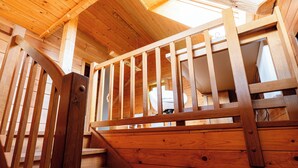 A wooden staircase with a railing leading to an upper level. - Pure nature with amazing view (Podjelje)