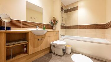 Combined shower/tub, hair dryer, towels, soap