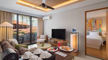 Suite, 2 Bedrooms | Living area | 43-inch flat-screen TV with cable channels, TV