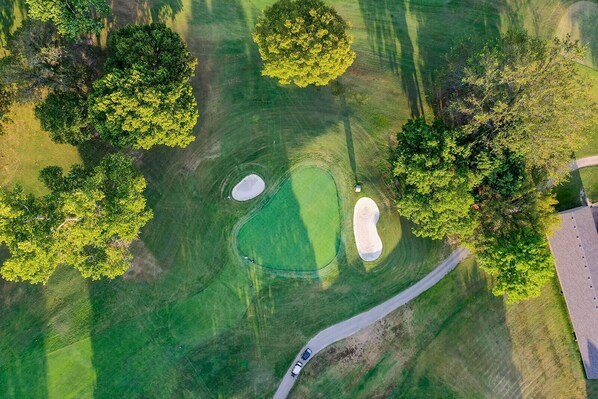 Enjoy a round of golf on our meticulously maintained course with challenging sand bunkers and varied terrain.