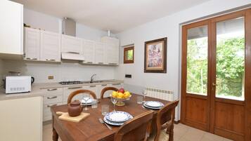 Family House, 2 Bedrooms, Mountainside (Villetta La Miniera) | Private kitchen | Fridge, microwave, oven, stovetop