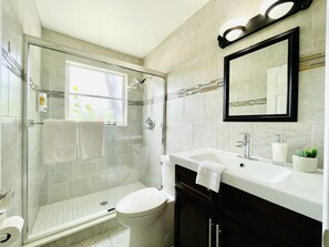 Bathtub, hair dryer, towels, soap
