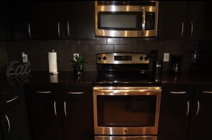 Microwave, dishwasher, coffee/tea maker, cookware/dishes/utensils