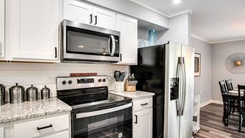 Coffee/tea maker, fridge, microwave, oven