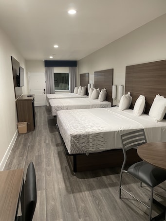 Family Room | Desk, blackout curtains, iron/ironing board, free WiFi. Palace Inn Blue - Garth Rd
