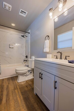 Combined shower/bathtub, hair dryer, towels, soap