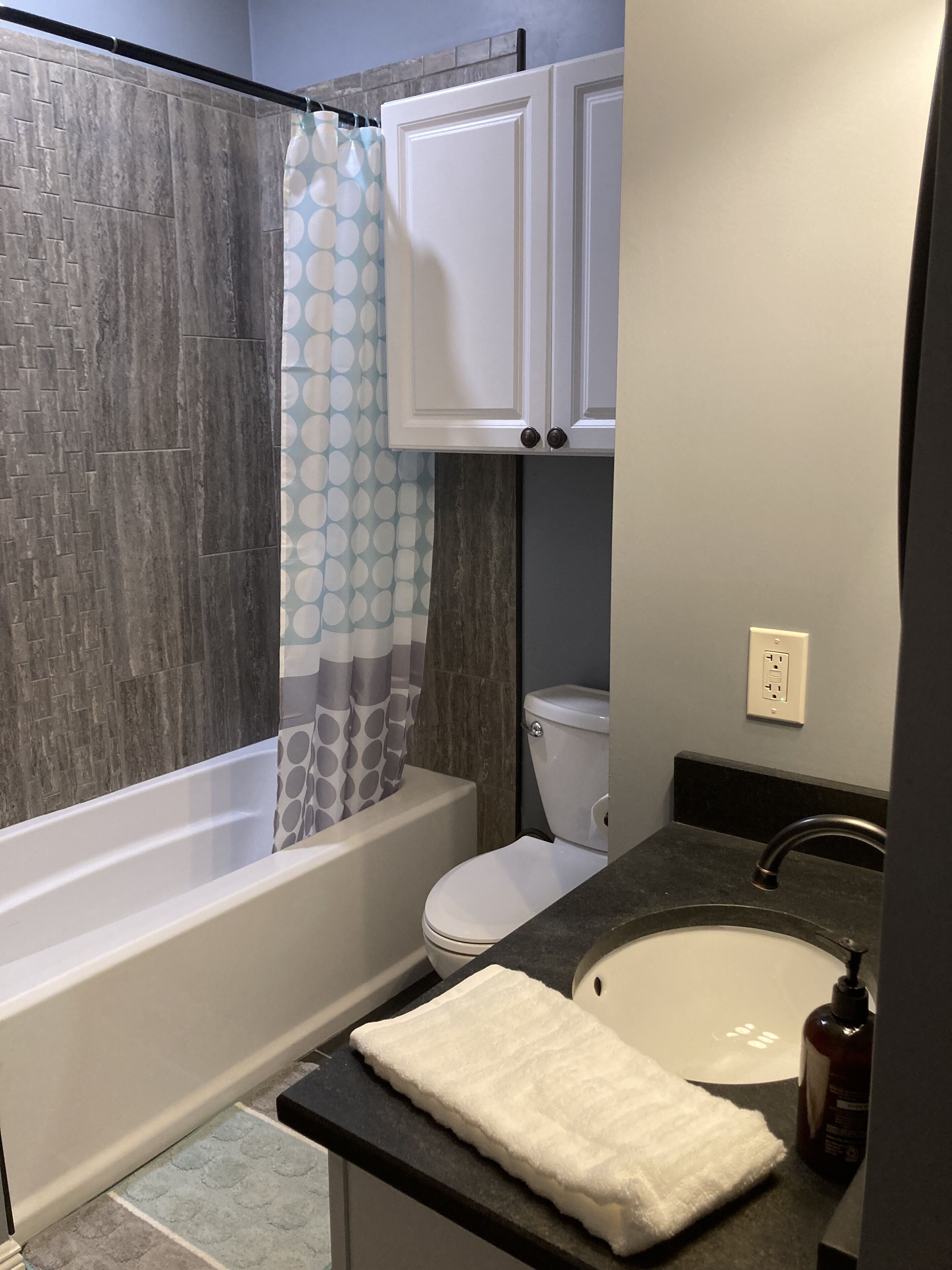 Combined shower/tub, hair dryer, towels, soap