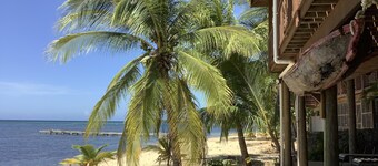 Beachfront home with pristine, calm waters, white sands and unbelievable sunset