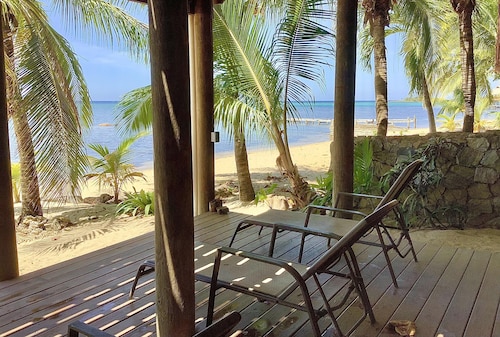 Beachfront home with pristine, calm waters, white sands and unbelievable sunset