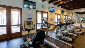 A gym with treadmills, stationary bikes, and an elliptical machine. - Relaxing Desert Villa in Resort Style property (La Quinta)