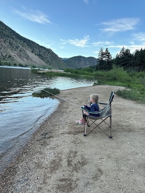 Guests can enjoy fishing and relaxation by the river.