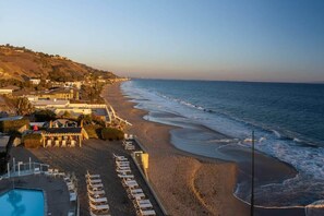 On the beach, sun-loungers, beach towels