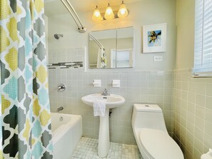 Bathtub, hair dryer, towels, soap