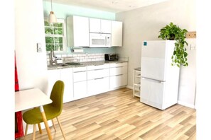 Fridge, microwave, stovetop, coffee/tea maker