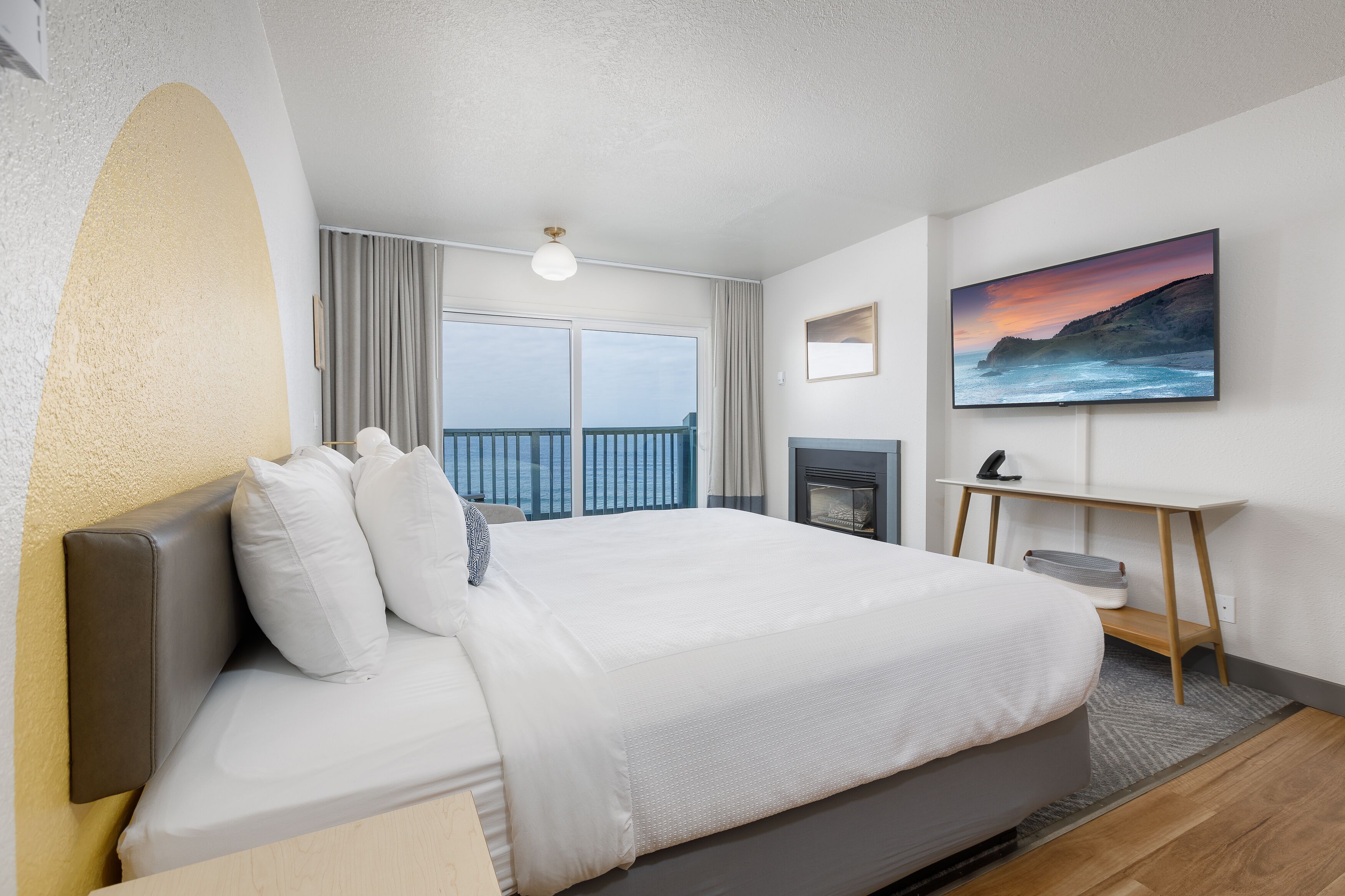 Deluxe Suite, Fireplace, Ocean View | Premium bedding, desk, laptop workspace, blackout curtains