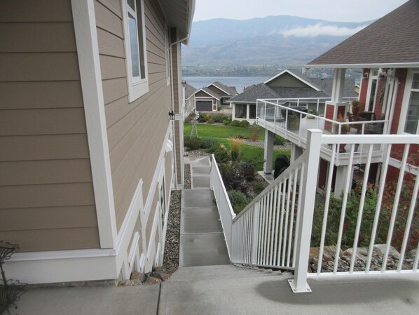 A residential building with a narrow staircase leading to a balcony.