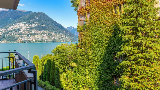 A balcony with a view of a lake and mountains. - Coloratura Frontlake Lugano with Terrace, Paradiso (Lugano), Switzerland (Paradiso (Lugano))