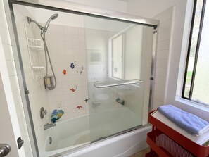 Combined shower/tub, hair dryer, towels, soap