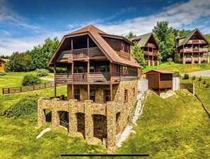 Set amidst lush surroundings, this cabin offers a central balcony and a symmetrical design.