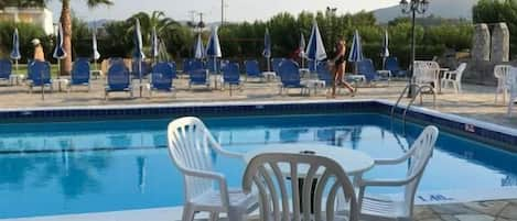 Seasonal outdoor pool, pool umbrellas, sun loungers