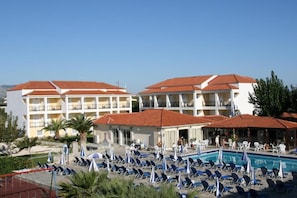 Seasonal outdoor pool, pool umbrellas, pool loungers