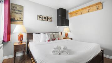 1 bedroom, desk, iron/ironing board, travel crib