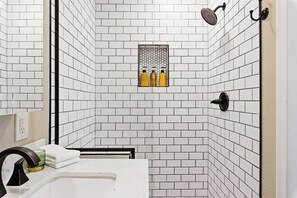 Combined shower/bathtub, hair dryer, towels, soap
