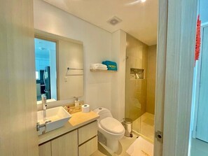 Shower, hair dryer, towels, soap