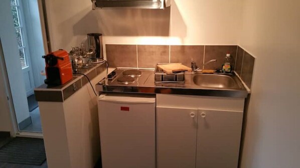 Microwave, coffee/tea maker, electric kettle, cookware/dishes/utensils
