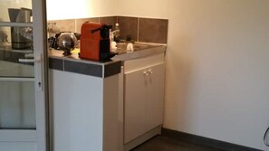 Microwave, coffee/tea maker, electric kettle, cookware/dishes/utensils