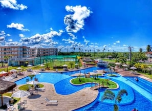 Indoor pool, outdoor pool, pool umbrellas, lifeguards on site
