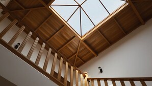 A wooden staircase with a skylight. - Casa Moci (Playa Blanca)