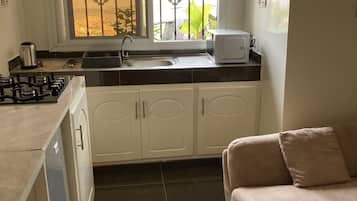Microwave, electric kettle, toaster, cookware/dishes/utensils