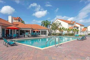Outdoor pool - Cozy apartment a few minutes away from Disney. (Kissimmee)