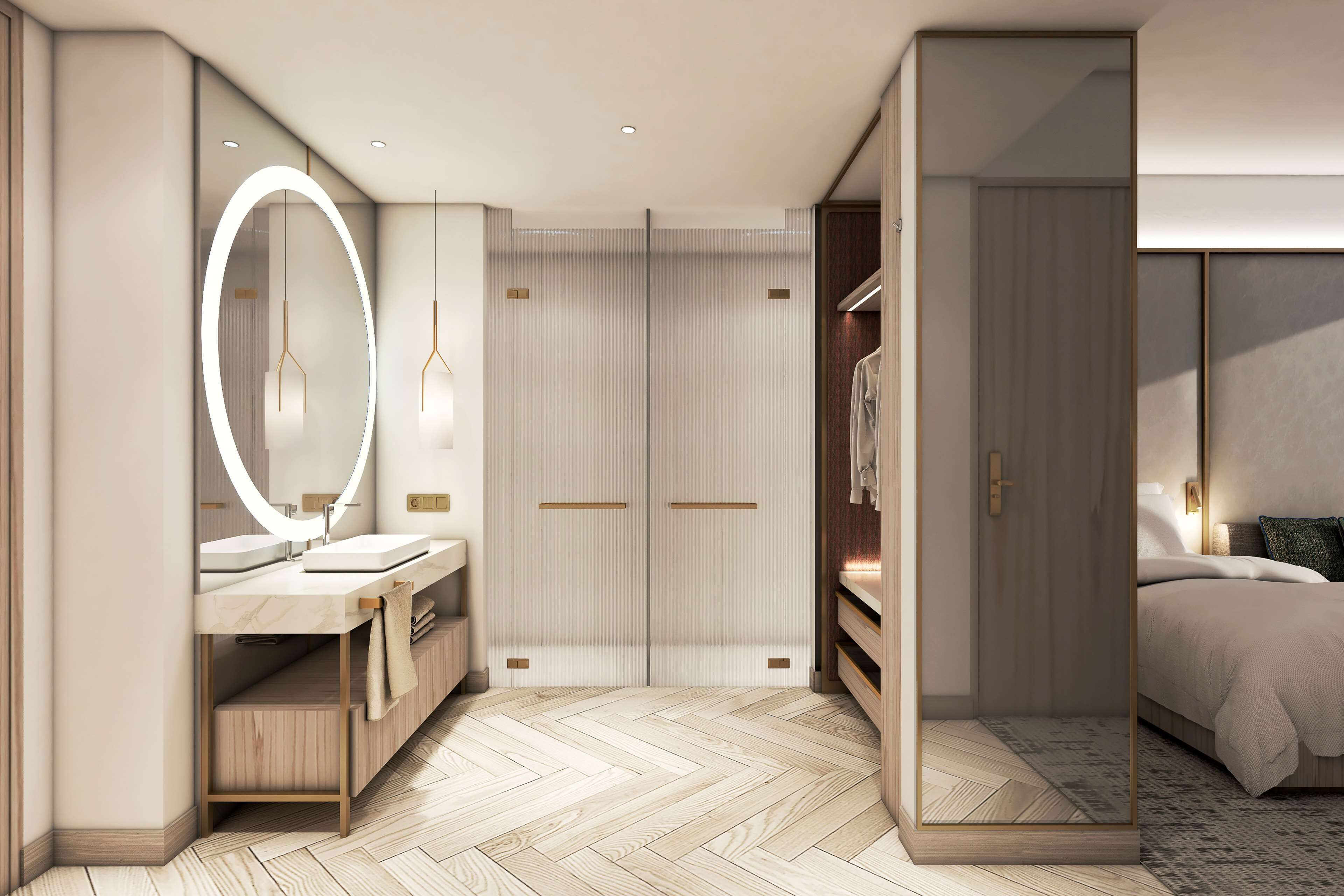 A modern bedroom with a large mirror, a vanity with a sink, and a bed with a headboard.