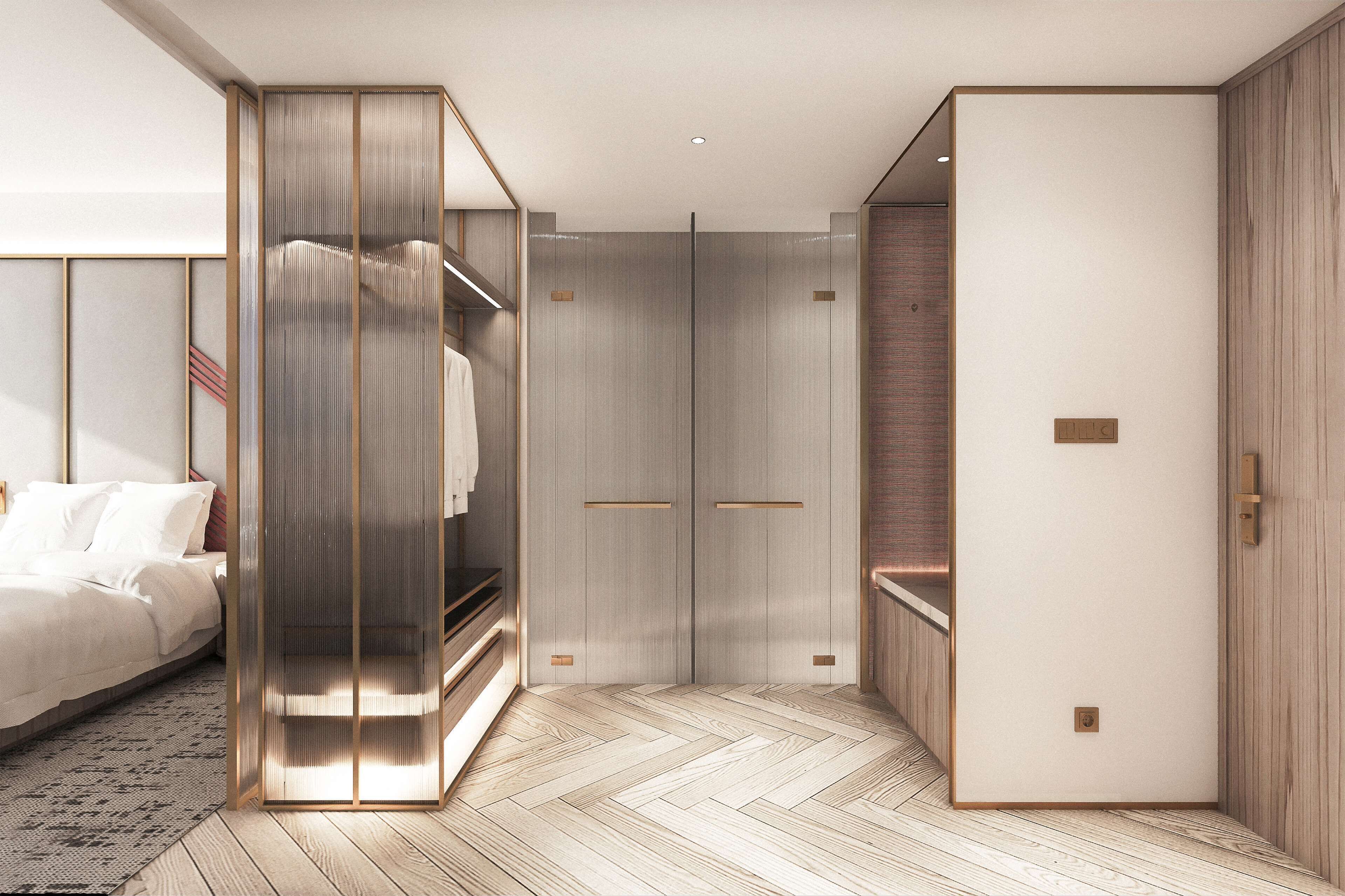 A modern bedroom with a bed, a wardrobe, and a walk-in closet.