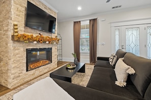 Smart TV, fireplace, books, stereo