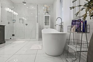 Combined shower/tub, hair dryer, towels, soap