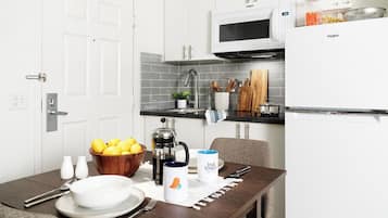 Full-size fridge, microwave, stovetop, freezer