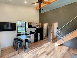 Enjoy cooking and dining in this well-equipped kitchen with a central island and bar stools.