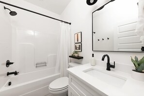 Bathtub, hair dryer, towels, soap