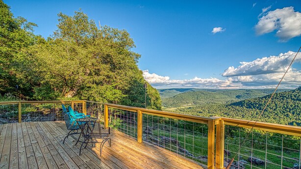A wooden deck with a view of a forested valley. - Best View! Beautiful Ozarks cabin ON rim of AR Grand Canyon! Many new updates (Jasper)