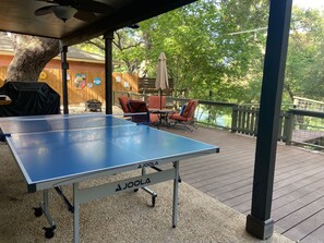 Outdoor dining - Waterhouse- 4 Bed, 3 bath, SUP, Kayak,  Ping pong, Decks galore (Seguin)