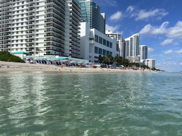 On the beach, sun-loungers, beach towels